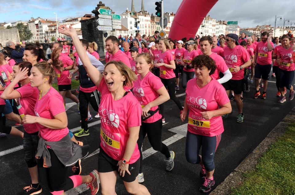 Runners take part in the 10 km Odyssea foot race in Bayonne on April 17, 2016.The participants, all clothed in pink, run to help fight against breast cancer in this charity foot race. / AFP / IROZ GAIZKA (Photo credit should read IROZ GAIZKA/AFP/Getty Images